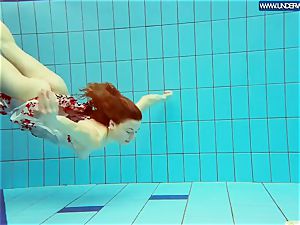 steamy polish red-haired swimming in the pool